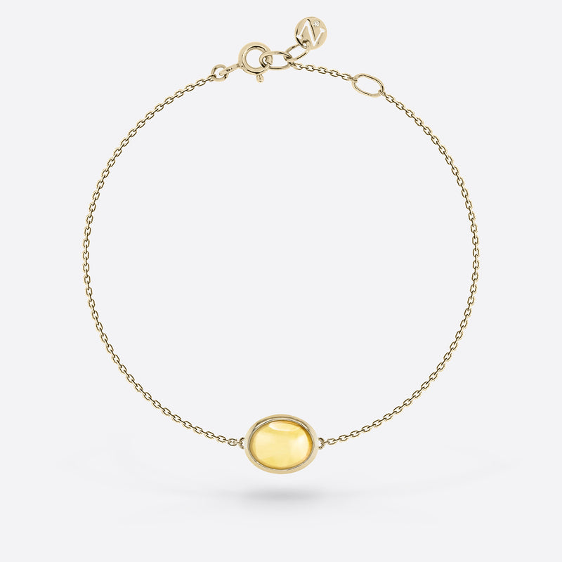 Bracelet chaîne or jaune  serti d une pierre citrine en forme ovale