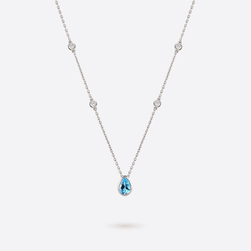 collier en or blanc 18k accompagne de diamants et topaze bleue en forme de poire