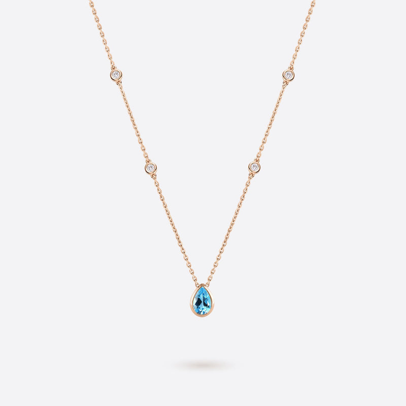 collier en or rose 18k accompagne de diamants et topaze bleue en forme de poire