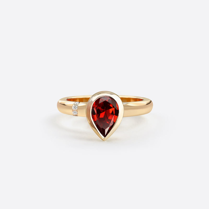 bague en forme de poire en or rose 18k sertie d une pierre grenat rouge et diamants