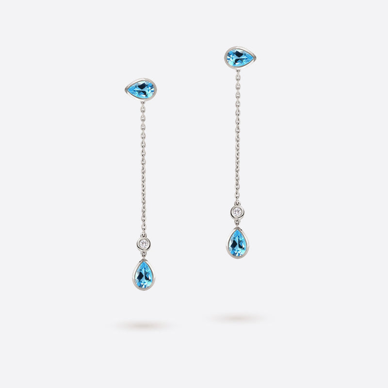 boucles d oreilles pendantes en forme de poire en or blanc 18k serties de pierres topaze bleue et diamants