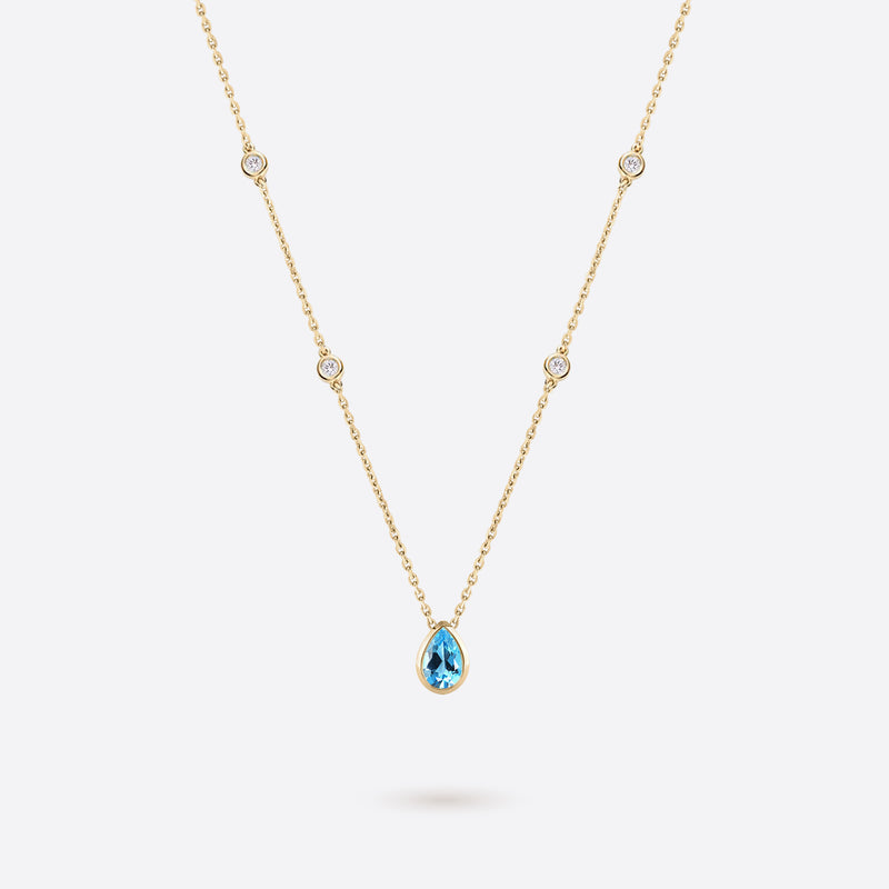 collier en argent plaque or jaune accompagne de diamants et topaze bleue en forme de poire