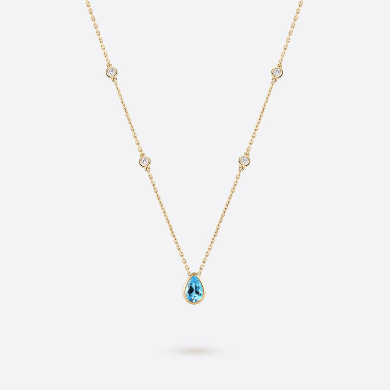 collier en or jaune 18k accompagne de diamants et topaze bleue en forme de poire